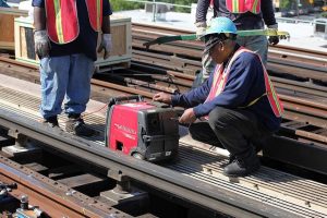 portable generator, workers, tracks