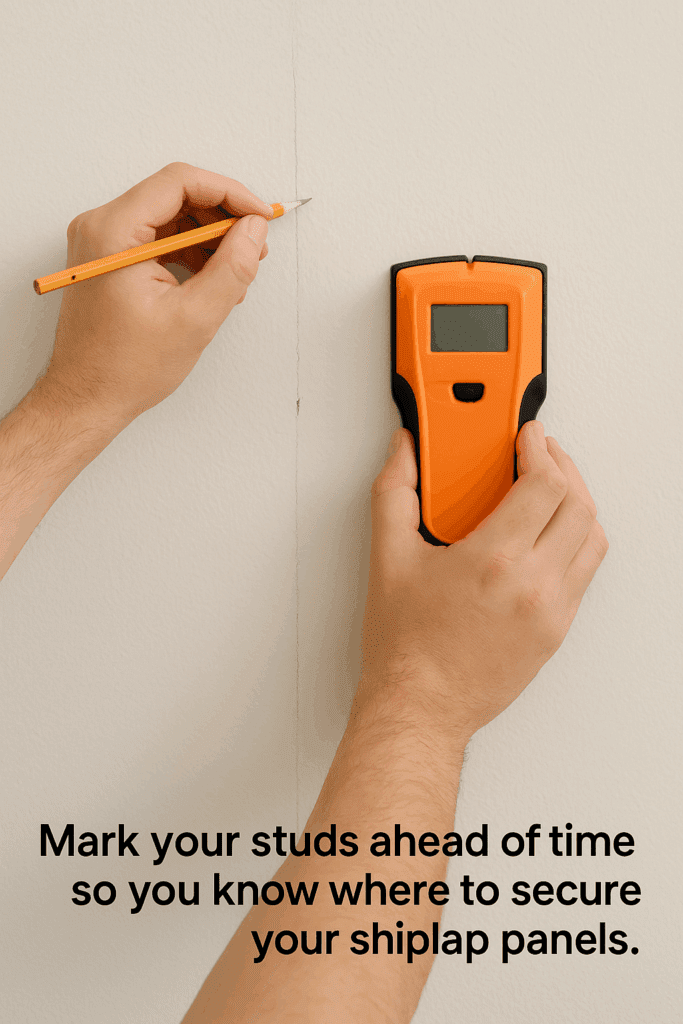Marking wall studs with pencil and stud finder